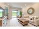 Living Room with light colored sofa and access to patio at 3066 Isles Way, New Smyrna Beach, FL 32168