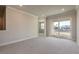 Bright bedroom with carpet, sliding glass doors to balcony at 3067 Isles Way, New Smyrna Beach, FL 32168