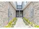 Inviting entryway with stone walls and landscaped walkway at 3067 Isles Way, New Smyrna Beach, FL 32168