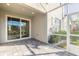 Covered patio with sliding glass doors and screened enclosure at 3067 Isles Way, New Smyrna Beach, FL 32168