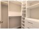 Large walk-in closet with shelving and drawers at 3088 Isles Way, New Smyrna Beach, FL 32168