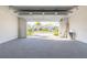 Attached garage with open door revealing a view of the community at 3088 Isles Way, New Smyrna Beach, FL 32168