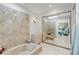 Primary bathroom with large bathtub and mirrored closet at 3103 Royal Palm Dr, Edgewater, FL 32141