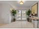 Bright entryway with tile floors and French doors leading to backyard at 3103 Royal Palm Dr, Edgewater, FL 32141