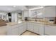 White kitchen with granite countertops and stainless steel appliances at 3103 Royal Palm Dr, Edgewater, FL 32141