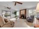 Spacious living room with fireplace and access to a screened porch at 3103 Royal Palm Dr, Edgewater, FL 32141