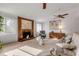 Living room with fireplace and ample natural light at 3103 Royal Palm Dr, Edgewater, FL 32141