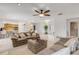 Living area featuring a sofa and a view into the kitchen at 3103 Royal Palm Dr, Edgewater, FL 32141