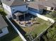 Aerial view of house showcasing backyard patio and landscaping at 3133 Crab Trap Dr, New Smyrna Beach, FL 32168