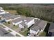 Aerial view of a neighborhood with houses and lush greenery at 3133 Crab Trap Dr, New Smyrna Beach, FL 32168