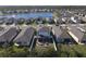 Aerial view of house and neighborhood, near a lake at 3133 Crab Trap Dr, New Smyrna Beach, FL 32168