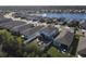 Aerial view of house and neighborhood, near a lake at 3133 Crab Trap Dr, New Smyrna Beach, FL 32168