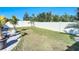 Grass backyard with a privacy fence and patio area at 3133 Crab Trap Dr, New Smyrna Beach, FL 32168