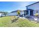 Backyard with patio, landscaping and privacy fence at 3133 Crab Trap Dr, New Smyrna Beach, FL 32168