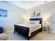 Bedroom with a queen-size bed and nightstand at 3133 Crab Trap Dr, New Smyrna Beach, FL 32168