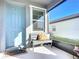 Front porch with a gray bench, pillows, and a blue door at 3133 Crab Trap Dr, New Smyrna Beach, FL 32168