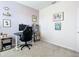 Bright home office with desk, chair, and inspirational wall art at 3133 Crab Trap Dr, New Smyrna Beach, FL 32168