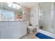 Clean bathroom with white vanity, toilet and shower at 3145 S Atlantic Ave # 804, Daytona Beach Shores, FL 32118