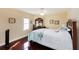 Comfortable bedroom with a double bed and hardwood floors at 3145 S Atlantic Ave # 804, Daytona Beach Shores, FL 32118