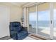 Relaxing recliner with stunning ocean view from the living room at 3145 S Atlantic Ave # 804, Daytona Beach Shores, FL 32118