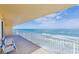 Stunning ocean view from a condo balcony, featuring two chairs at 3145 S Atlantic Ave # 804, Daytona Beach Shores, FL 32118