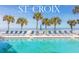 Community pool with ocean view and lounge chairs at 3145 S Atlantic Ave # 804, Daytona Beach Shores, FL 32118