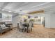 Kitchen and dining area with tiled floors and wooden beams at 321 Jessamine Ave, New Smyrna Beach, FL 32169