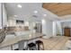 Bright kitchen with white cabinets, stainless steel appliances, and granite countertops at 321 Jessamine Ave, New Smyrna Beach, FL 32169