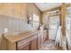 Laundry room with wood cabinets, countertop, and exterior access at 321 Jessamine Ave, New Smyrna Beach, FL 32169