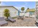 Outdoor patio with brick paving, seating area, and adjacent outdoor shower at 321 Jessamine Ave, New Smyrna Beach, FL 32169