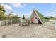 A-frame guest house and rooftop deck with seating area at 321 Jessamine Ave, New Smyrna Beach, FL 32169