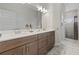 Modern bathroom with double vanity and walk-in shower at 3309 Modena Way, New Smyrna Beach, FL 32168