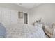 Spacious bedroom with a queen-size bed and an armchair at 3309 Modena Way, New Smyrna Beach, FL 32168