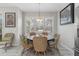 Charming breakfast nook with round table and wicker chairs near a window at 3309 Modena Way, New Smyrna Beach, FL 32168