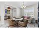 Bright dining area with round table and wicker chairs, offering a casual and comfortable space at 3309 Modena Way, New Smyrna Beach, FL 32168