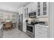 White cabinets, stainless steel appliances, and a spacious layout highlight this kitchen at 3309 Modena Way, New Smyrna Beach, FL 32168