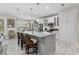 Modern kitchen featuring white cabinets, stainless steel appliances, and a large island at 3309 Modena Way, New Smyrna Beach, FL 32168