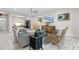 Living room with a grey couch and wicker armchairs at 3309 Modena Way, New Smyrna Beach, FL 32168