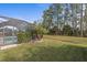 Screened pool with palm trees and tranquil backyard setting at 3309 Modena Way, New Smyrna Beach, FL 32168