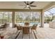 Covered patio with pool and seating area, perfect for outdoor dining and relaxation at 3309 Modena Way, New Smyrna Beach, FL 32168