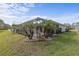 Screened pool with palm trees and spacious backyard at 3309 Modena Way, New Smyrna Beach, FL 32168