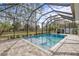 Relaxing screened pool with a spacious deck, ideal for sunny days at 3309 Modena Way, New Smyrna Beach, FL 32168