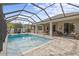 Large, refreshing pool with a screened enclosure and ample patio space for lounging at 3309 Modena Way, New Smyrna Beach, FL 32168