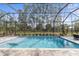 Inviting, refreshing swimming pool with a screened enclosure and expansive views at 3309 Modena Way, New Smyrna Beach, FL 32168