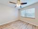 Bright bedroom with ceiling fan and window blinds at 3800 Saxon Dr # 39039C, New Smyrna Beach, FL 32169