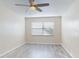 Bedroom featuring wood-look floors and a window at 3800 Saxon Dr # 39039C, New Smyrna Beach, FL 32169