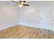 Bright living room with light walls, wood-look floors, and ceiling fan at 3800 Saxon Dr # 39039C, New Smyrna Beach, FL 32169