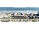 Aerial view of beachfront condo building with parking and pool at 3801 S Atlantic Ave # 304, New Smyrna Beach, FL 32169