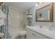 Bathroom with shower/tub combo and updated vanity at 3801 S Atlantic Ave # 304, New Smyrna Beach, FL 32169