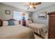 Guest bedroom with two twin beds and beachy decor at 3801 S Atlantic Ave # 304, New Smyrna Beach, FL 32169